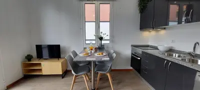 a small kitchen with a table with food on it at Villa City in Funchal
