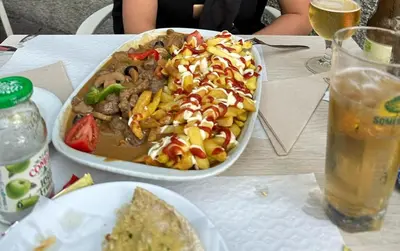 a table with a bowl of food and a plate of food at Apartment in Camara de Lobos not shared in Câmara de Lobos