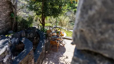 an overhead view of a table and chairs on a patio at Stonewood Valley by LovelyStay in Curral das Freiras