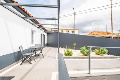 a balcony with a table and chairs on a building at City Haven by Homie in Funchal