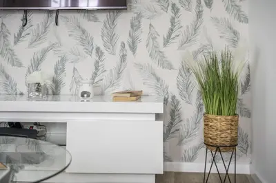 a bathroom with a white counter with a plant in a basket at City Haven by Homie in Funchal