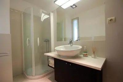 a bathroom with a sink and a shower at Forum Apartment by HR Madeira in Funchal