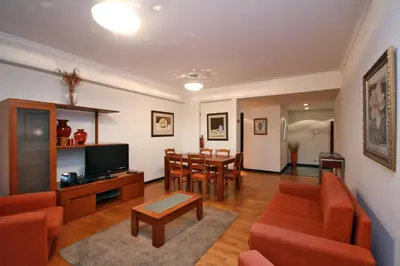a living room with a couch and a table at Forum Apartment by HR Madeira in Funchal