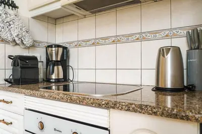 a kitchen with a counter top with a coffee maker at Villa Fillmare in Lagos