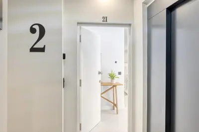 a hallway with a door with the number on it at Beco Santa Emilia 2I, a Home in Madeira in Funchal