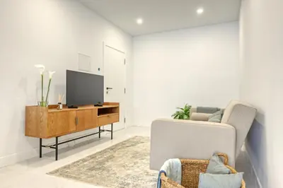 a living room with a tv and a couch at Beco Santa Emilia 2G, a Home in Madeira in Funchal