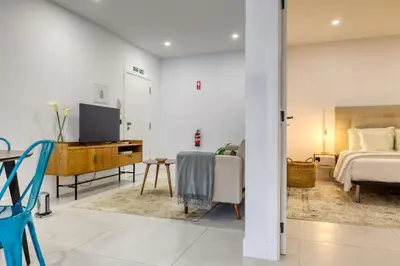 a bedroom with a bed and a desk at Beco Santa Emilia 2G, a Home in Madeira in Funchal
