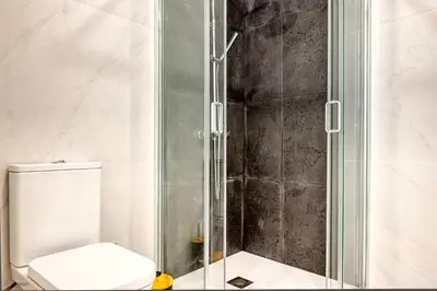 a bathroom with a shower with a toilet at Beco Santa Emilia 2G, a Home in Madeira in Funchal