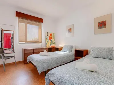 a small kitchen with white cabinets and a sink at Flat in Praia da Luz with Sea Views in Luz