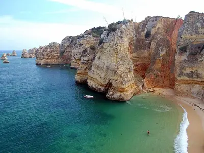 an aerial view of a beach with a rocky cliffs at Flat in Praia da Luz with Sea Views in Luz