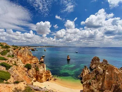 a view of a beach with boats in the water at Flat in Praia da Luz with Sea Views in Luz