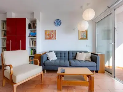 a living room with a white table and chairs at Flat in Praia da Luz with Sea Views in Luz