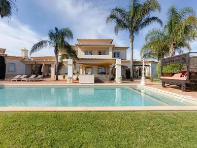 a house with a swimming pool in front of a house at Luxury villa with gym, jacuzzi and swimming pool in Lagos
