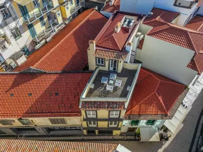 an overhead view of roofs of buildings with red roofs at Studios Funchal in Funchal
