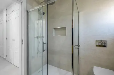 a shower with a glass door in a bathroom at The Look-Out Sagres in Sagres