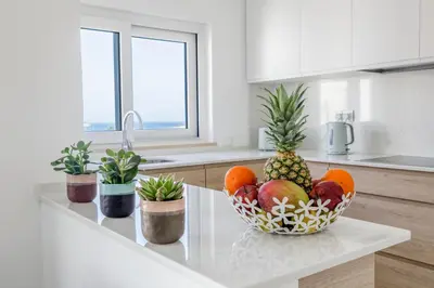 a bowl of fruit on a counter in a kitchen at The Look-Out Sagres in Sagres
