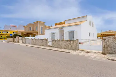 a white house on the side of a street at Sunny Sagres in Sagres