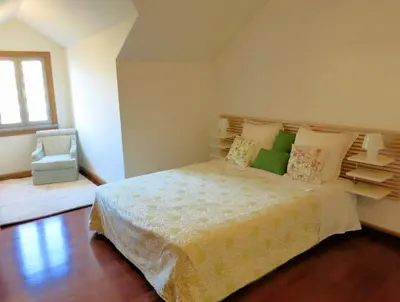 a bedroom with a large bed and a window at Superior Rentals - Beachfront Penthouse in Funchal
