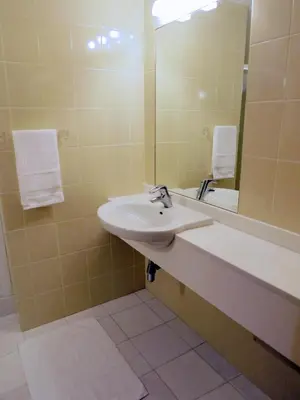 a bathroom with a sink and a toilet and a shower at Superior Rentals - Beachfront Penthouse in Funchal