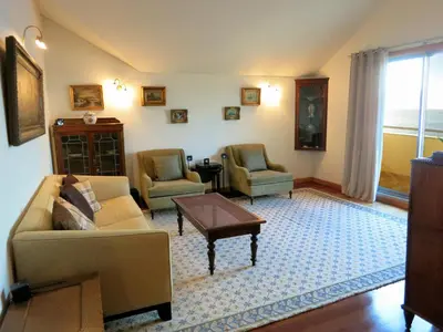 a living room with a couch and two chairs and a table at Superior Rentals - Beachfront Penthouse in Funchal