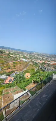 a view of a city from a street with a road at Peaceful Valley house in Câmara de Lobos