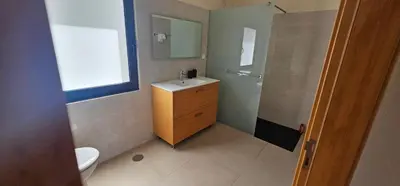 a bathroom with a sink and a shower at Peaceful Valley house in Câmara de Lobos