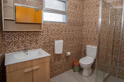a small bathroom with a sink and a toilet at Sunset Star II With Sea View in Calheta