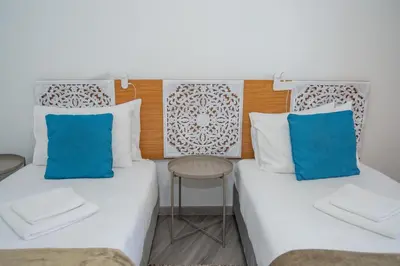 a bedroom with a bed in a room at Sunset Star II With Sea View in Calheta
