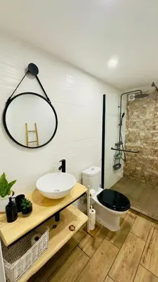 a bathroom with a sink and a toilet at Cantinho das Pedras in Funchal
