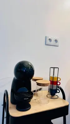 a coffee maker sitting on top of a table at Cantinho das Pedras in Funchal