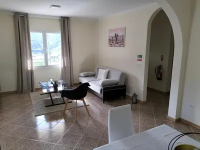 a living room with a couch and a table at CASA Bela Vista in Machico