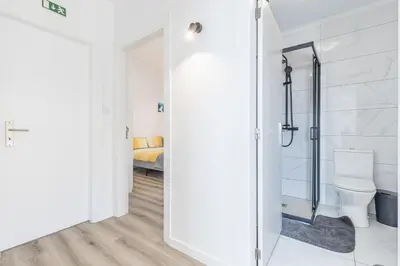 a bathroom with a toilet and a shower at Maylily Seascape Villa in Santa Cruz