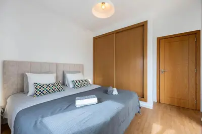 a bedroom with two beds with towels on them at Casa Cláudia - Cond Atalaia in Lagos