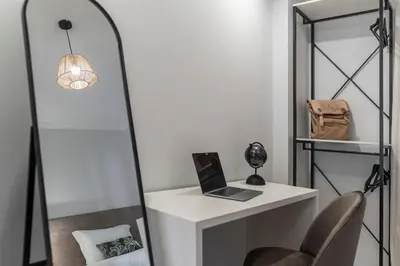 a room with a desk with a laptop on it at Santa Cruz II by An Island Apart in Santa Cruz