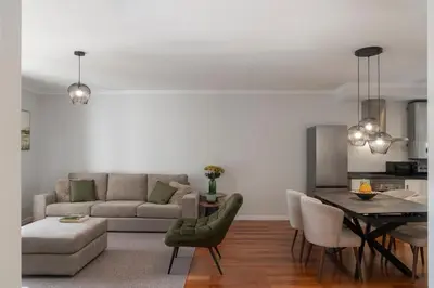 a living room with a couch and a table at Santa Cruz II by An Island Apart in Santa Cruz