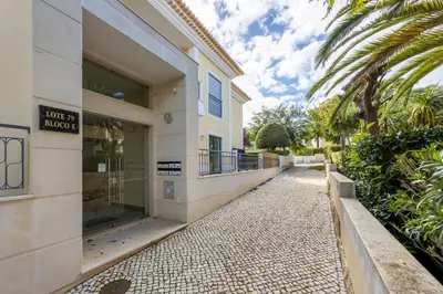 a building with a sidewalk in front of a building at Apartment República in Lagos
