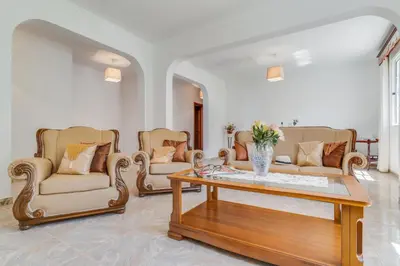 a living room with couches and a coffee table at Familia Teixeira House by AH in Arco da Calheta