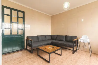 a living room with a couch and a coffee table at Familia Teixeira House by AH in Arco da Calheta