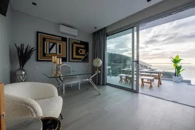 a living room with a view of the ocean at Villa Pérola in Calheta