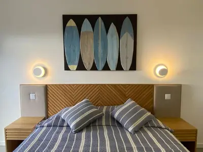 a bedroom with a bed with two pillows at Concha is a NEW apartment * 5min walk to the beach in Luz
