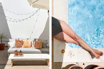 a woman sitting on a couch next to a pool at Casa de Pinheiro in Aljezur
