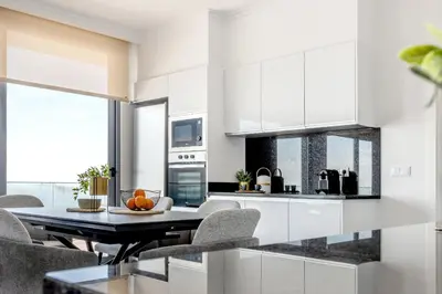 a kitchen and dining room with a table and chairs at Villa Serenity in Prazeres