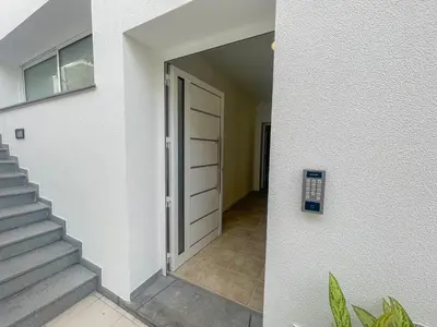 a door leading to a hallway in a house at Villa Supranee Relaxation in Câmara de Lobos