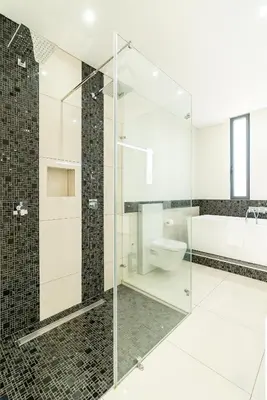 a bedroom with a white bed and a pink wall at Vincents Place I Ocean View I Swimming pool in Estreito da Calheta