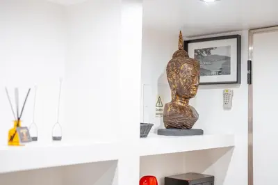 a statue sitting on a shelf in a room at PAKISA - Three bedroom apartment in Funchal