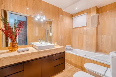 a bathroom with a sink and a tub at PAKISA - Three bedroom apartment in Funchal