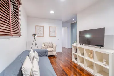 a living room with a tv and a couch at PAKISA - Three bedroom apartment in Funchal