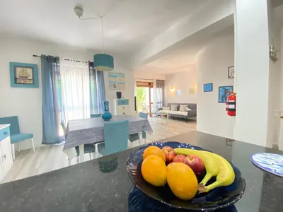 a bowl of fruit on a table in a living room at NEW Luztur apartment 3min from Luz Beach in Luz