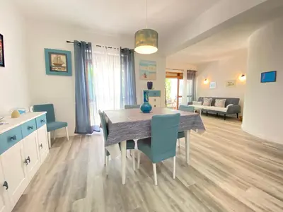 a kitchen and dining room with a table and chairs at NEW Luztur apartment 3min from Luz Beach in Luz