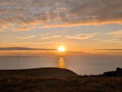 a sunset over the ocean with the sun in the sky at Apartamentos Aurea - Porto Santo in Porto Santo